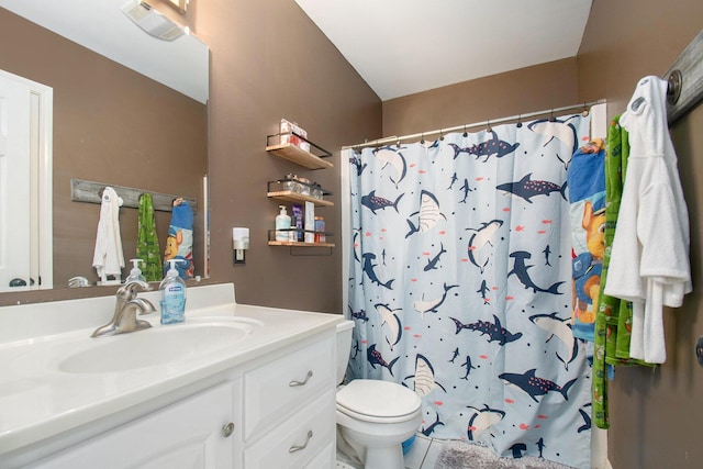 bathroom featuring visible vents, toilet, curtained shower, and vanity