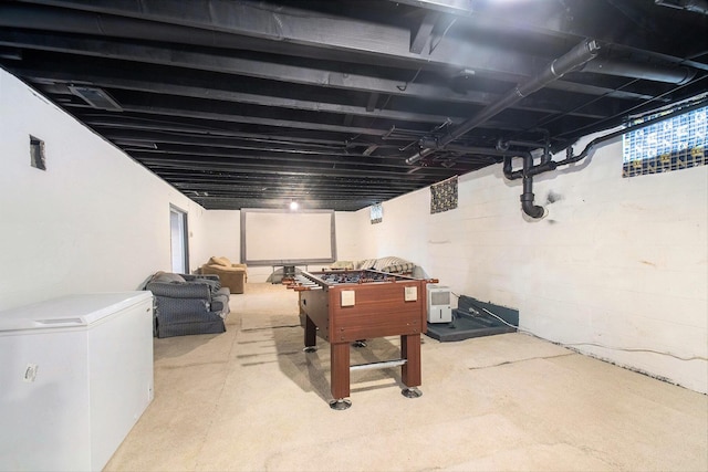 rec room featuring concrete floors