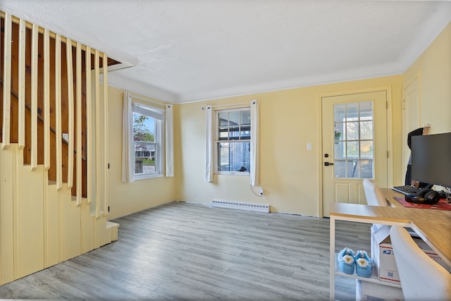 21160 Inkster Rd, Southfield, MI 48033 - unfurnished living room with wood finished floors and a baseboard radiator