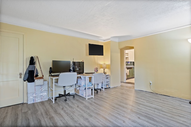 21160 Inkster Rd, Southfield, MI 48033 - office area with a textured ceiling, ornamental molding, arched walkways, and wood finished floors