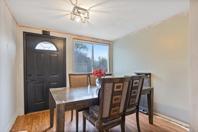 21160 Inkster Rd, Southfield, MI 48033 - dining space with baseboards, crown molding, and wood finished floors