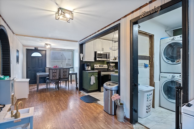 21160 Inkster Rd, Southfield, MI 48033 - clothes washing area with laundry area and stacked washer and dryer