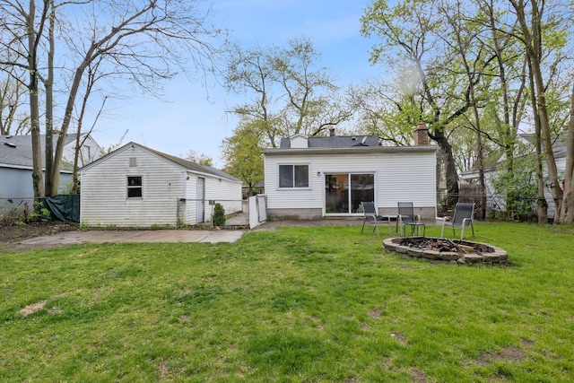 21160 Inkster Rd, Southfield, MI 48033 - back of property with an outdoor fire pit, a gate, a chimney, a yard, and fence private yard