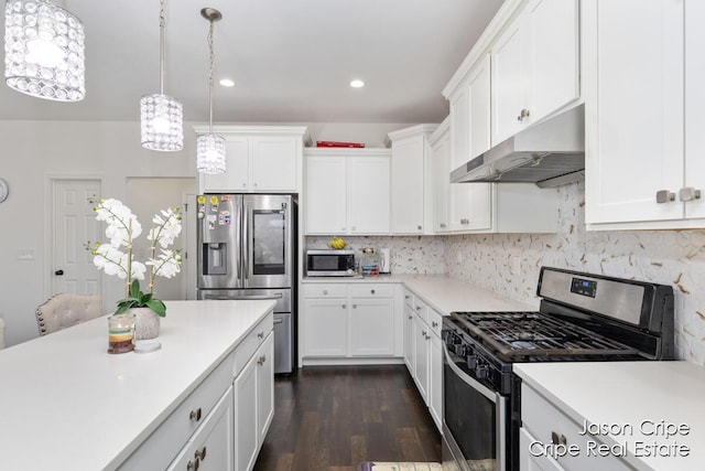 kitchen featuring white cabinets, light countertops, appliances with stainless steel finishes, and under cabinet range hood