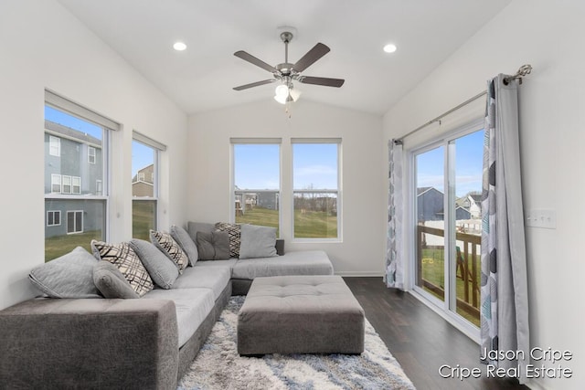 living room featuring dark wood-style floors, a healthy amount of sunlight, a ceiling fan, and lofted ceiling