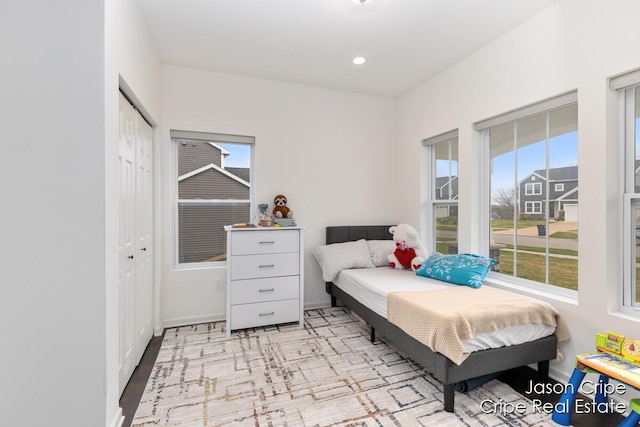 bedroom featuring a closet and recessed lighting