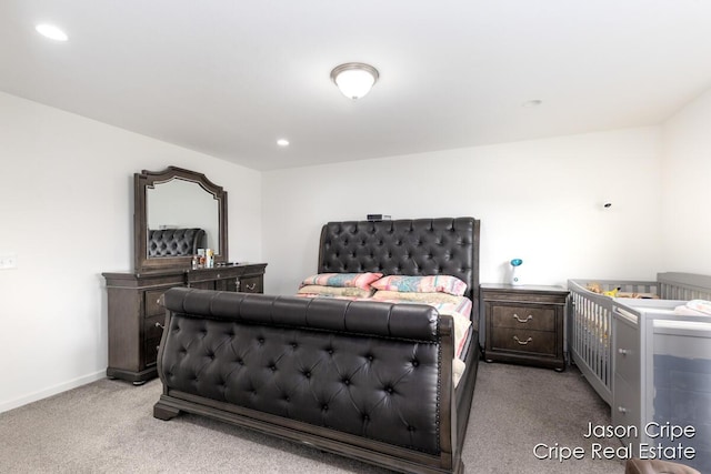 bedroom with light carpet, recessed lighting, and baseboards