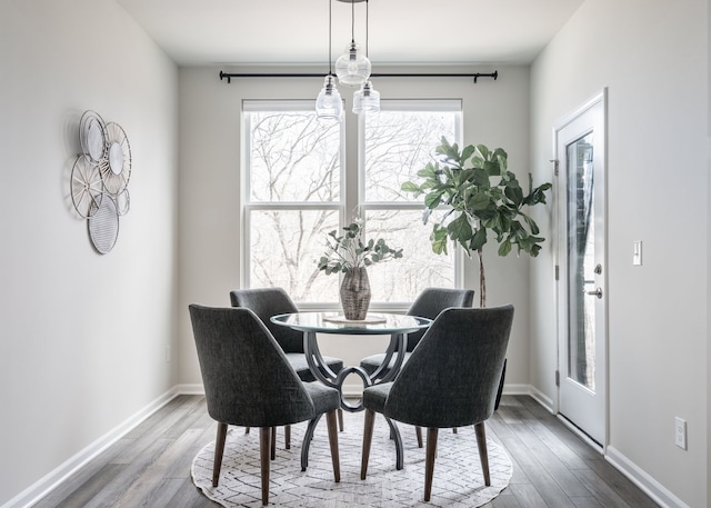 dining room with wood finished floors and baseboards