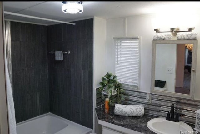 50594 Oregon Ave, Novi, MI 48374 - full bath featuring bathing tub / shower combination, vanity, and backsplash