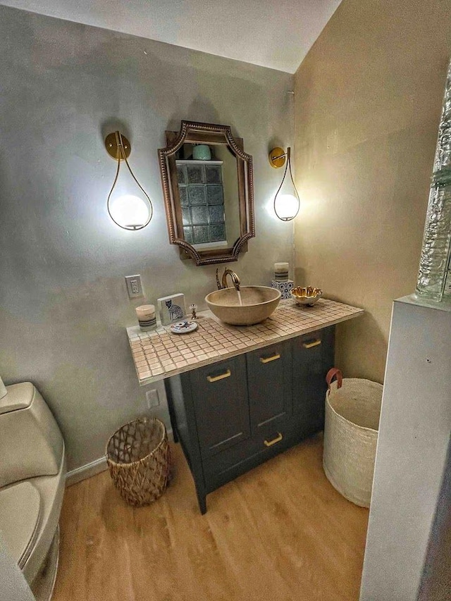 520 Bellevue Ave, Lake Orion, MI 48362 - bathroom with wood finished floors and vanity