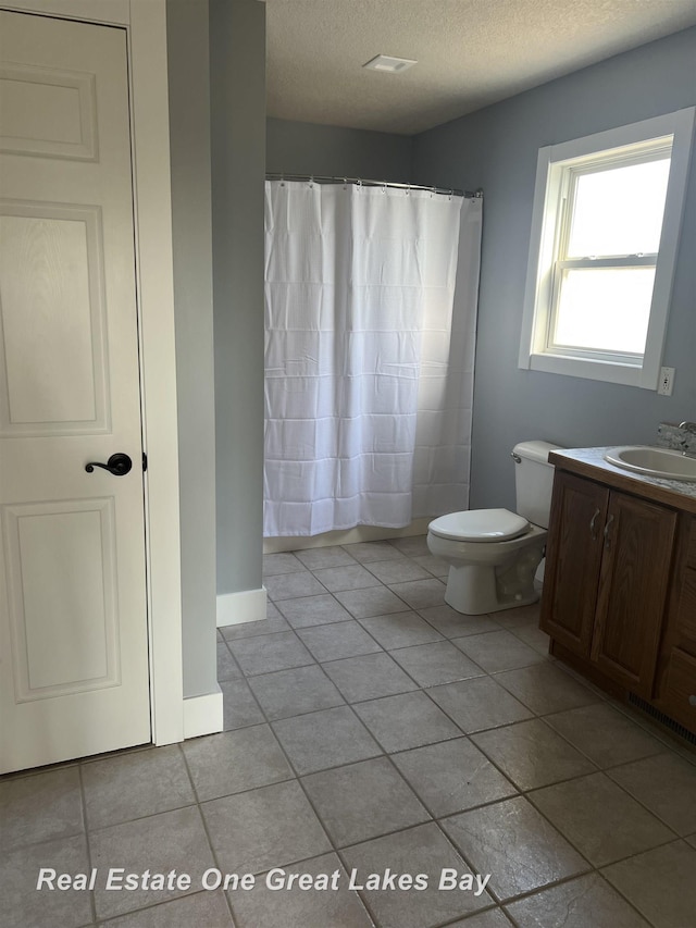 8311 Goldfinch Rd, Freeland, MI 48623 - bathroom featuring a textured ceiling, vanity, tile patterned flooring, and a shower with shower curtain