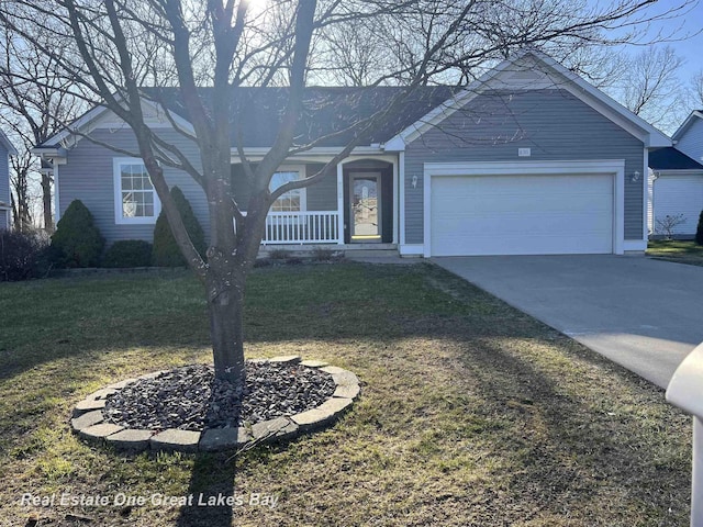 8311 Goldfinch Rd, Freeland, MI 48623 - ranch-style house with concrete driveway, a front yard, an attached garage, and covered porch