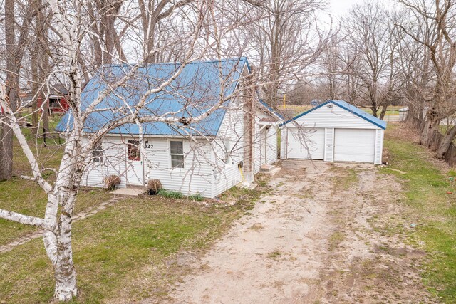 327 E Main St, Vermontville, MI 49096 - exterior space featuring an outbuilding and a detached garage