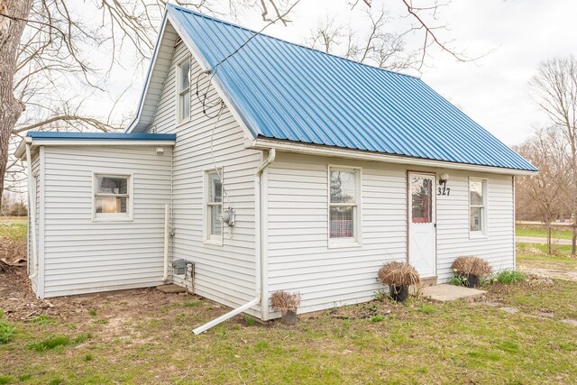 327 E Main St, Vermontville, MI 49096 - view of side of property with metal roof