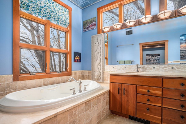 full bathroom with a bath, visible vents, and vanity