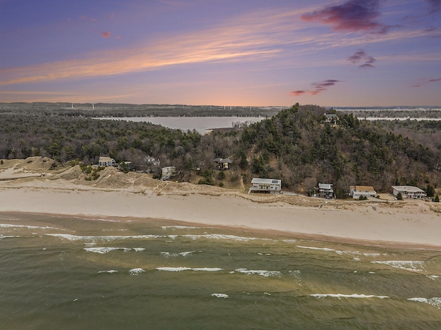 bird's eye view with a view of the beach and a water view