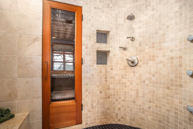 bathroom featuring tiled shower