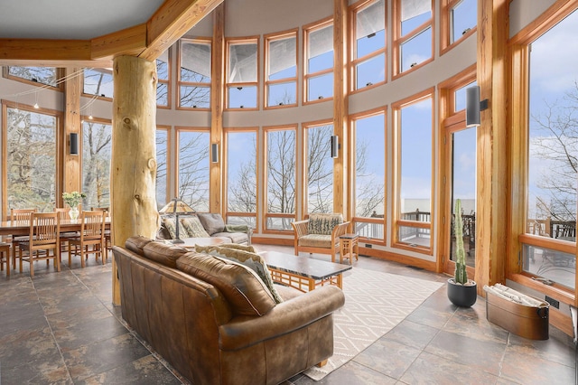 living room with stone tile floors