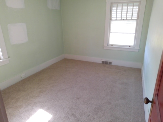 802 Oakridge Dr, Jackson, MI 49203 - spare room with carpet floors and baseboards