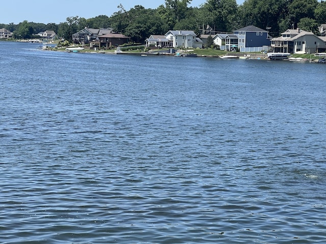940 E Eagle Lake Dr, Kalamazoo, MI 49009 - water view featuring nearby suburban area and a tree filled landscape