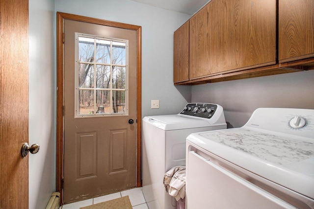 washroom with cabinet space, light tile patterned floors, washer and clothes dryer, and a baseboard heating unit
