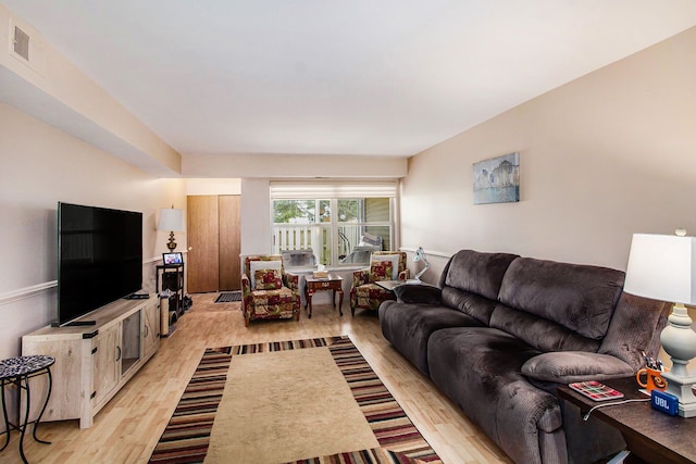 61043 Greenwood Dr # 167, South Lyon, MI 48178 - living room with light wood-style floors