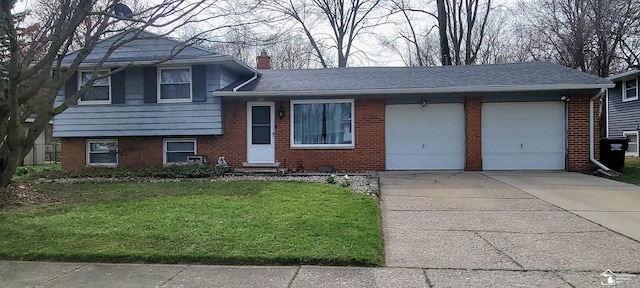 7303 Cranbrook Dr, Lambertville, MI 48144 - tri-level home with a chimney, a front yard, brick siding, concrete driveway, and an attached garage