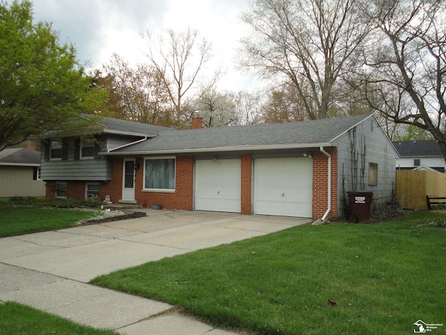 7303 Cranbrook Dr, Lambertville, MI 48144 - tri-level home with concrete driveway, brick siding, a front lawn, and a garage
