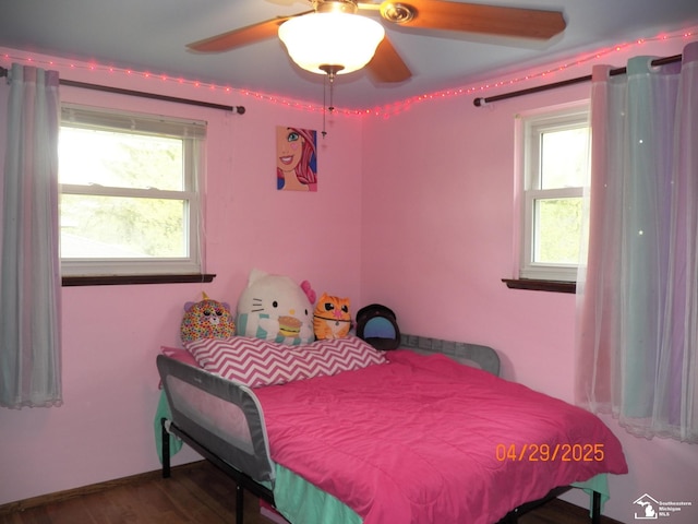 7303 Cranbrook Dr, Lambertville, MI 48144 - bedroom with a ceiling fan, multiple windows, and wood finished floors