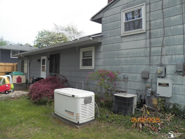 7303 Cranbrook Dr, Lambertville, MI 48144 - view of property exterior featuring fence and central AC unit