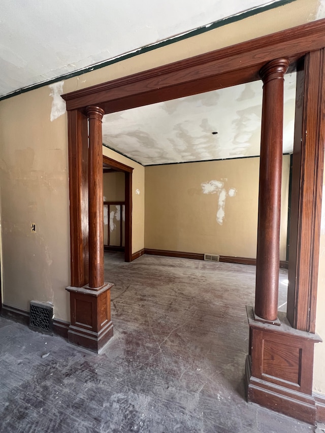 207 Connecticut St, Highland Park, MI 48203 - unfurnished living room with visible vents and ornate columns