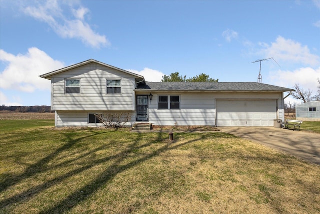 split level home featuring concrete driveway, a front yard, and a garage