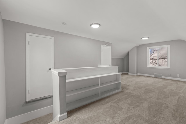 19319 Huntington Rd, Detroit, MI 48219 - additional living space featuring lofted ceiling, carpet floors, visible vents, and baseboards