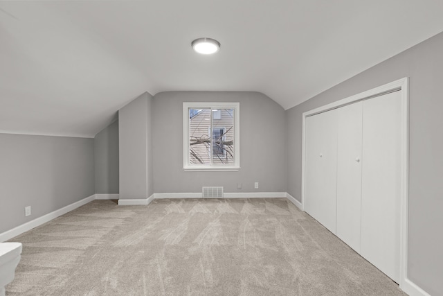 19319 Huntington Rd, Detroit, MI 48219 - bonus room featuring lofted ceiling, visible vents, baseboards, and light carpet