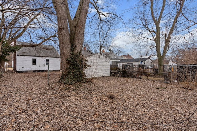 19319 Huntington Rd, Detroit, MI 48219 - view of yard featuring an outbuilding and fence