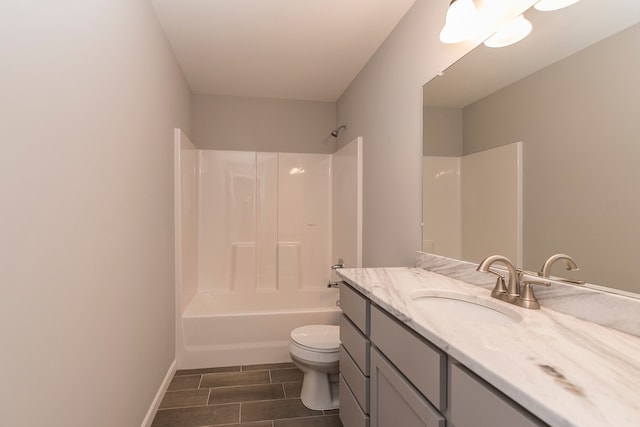 5192 Rolling Hills Dr, Grand Blanc, MI 48439 - full bathroom featuring wood tiled floor, vanity, shower / bath combination, baseboards, and toilet