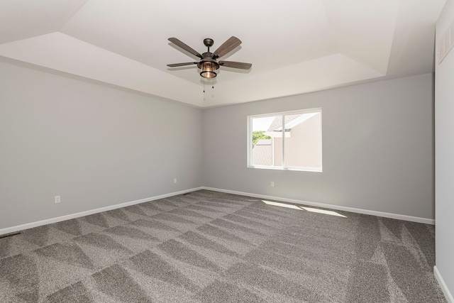 5192 Rolling Hills Dr, Grand Blanc, MI 48439 - empty room featuring baseboards, a ceiling fan, carpet flooring, and a raised ceiling