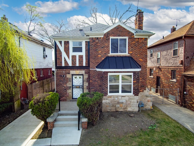 19319 Pennington Dr, Detroit, MI 48221 - view of front of home featuring a gate, stone siding, a chimney, and fence