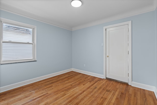 19319 Pennington Dr, Detroit, MI 48221 - spare room featuring baseboards, crown molding, and light wood-style flooring
