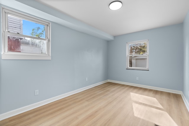 19319 Pennington Dr, Detroit, MI 48221 - empty room with wood finished floors and baseboards