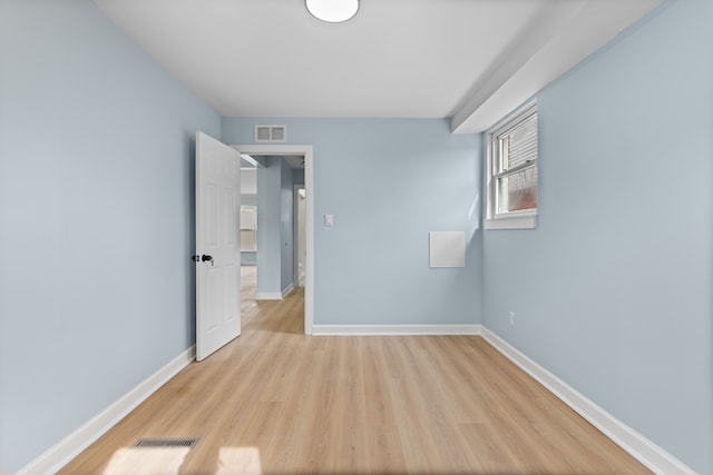 19319 Pennington Dr, Detroit, MI 48221 - spare room featuring light wood-style floors, visible vents, and baseboards