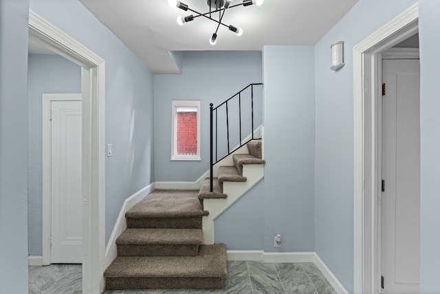 19319 Pennington Dr, Detroit, MI 48221 - stairs featuring baseboards and an inviting chandelier
