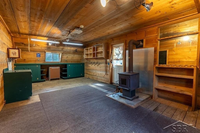 interior space featuring wood-type flooring, wood walls, and wood ceiling