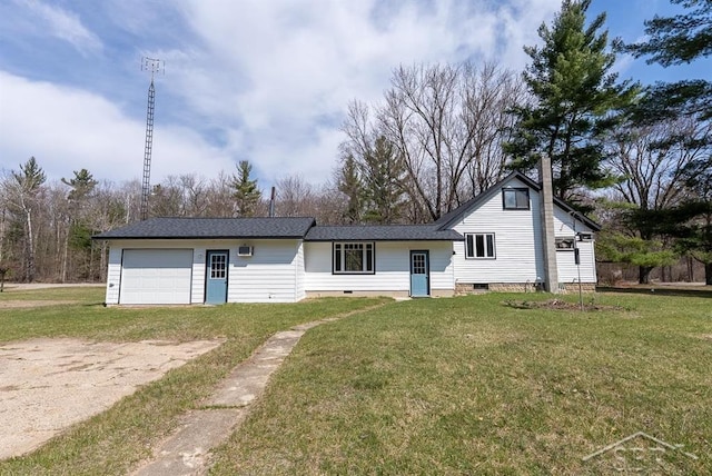 view of front of home featuring a chimney, a front lawn, crawl space, driveway, and a garage