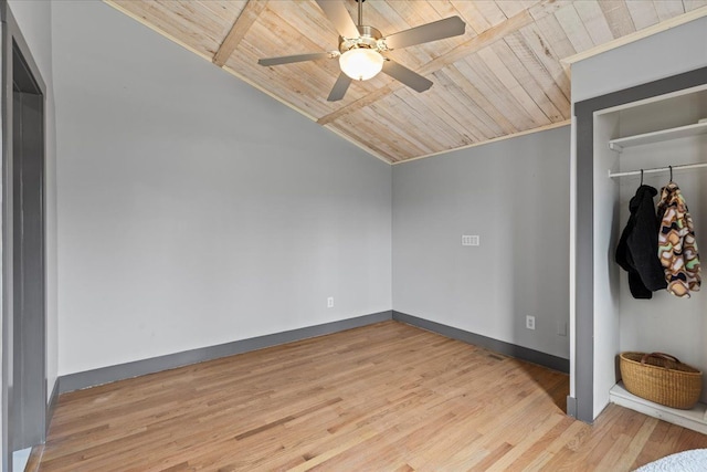 unfurnished bedroom with light wood-style flooring, vaulted ceiling, baseboards, a closet, and wooden ceiling