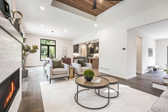 2359 Elinor Ln SE, East Grand Rapids, MI 49506 - living area featuring recessed lighting, a brick fireplace, wood finished floors, and visible vents