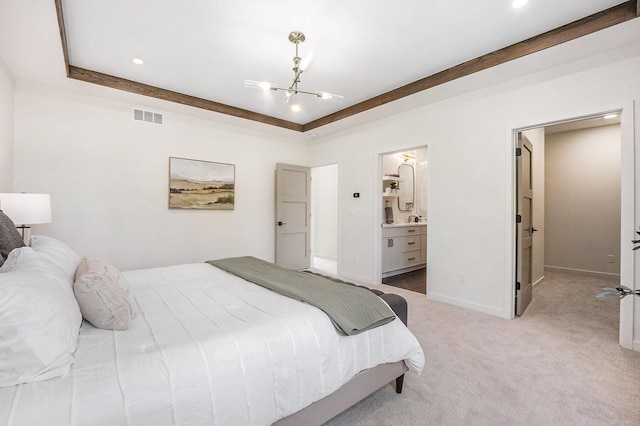 2359 Elinor Ln SE, East Grand Rapids, MI 49506 - bedroom with ensuite bathroom, a chandelier, light colored carpet, baseboards, and visible vents