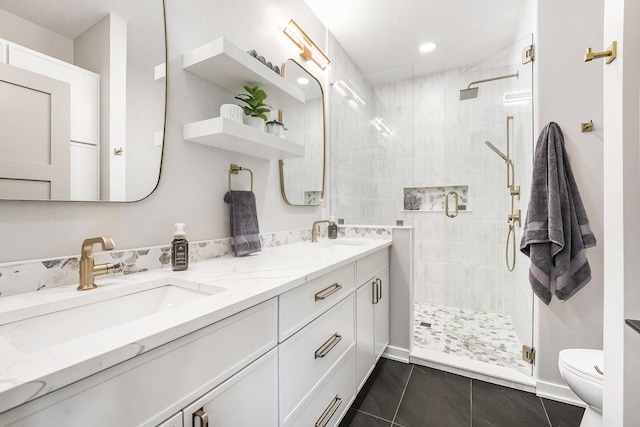 2359 Elinor Ln SE, East Grand Rapids, MI 49506 - bathroom with a sink, a shower stall, double vanity, and toilet