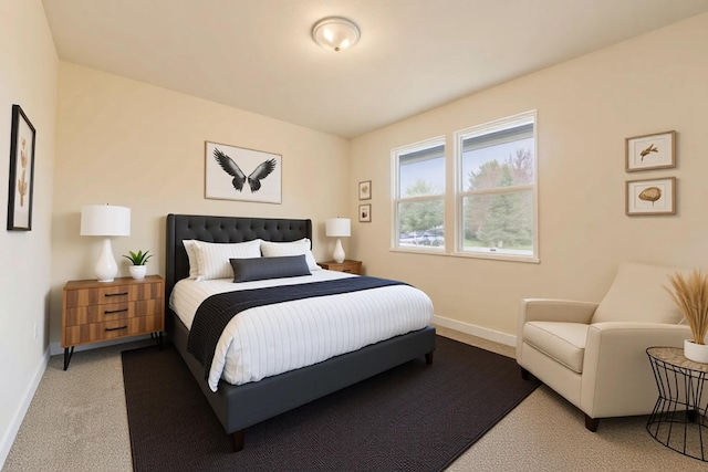 carpeted bedroom featuring baseboards