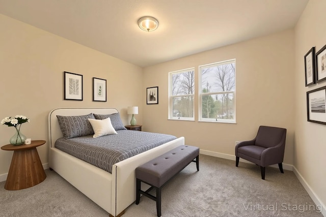 carpeted bedroom featuring baseboards